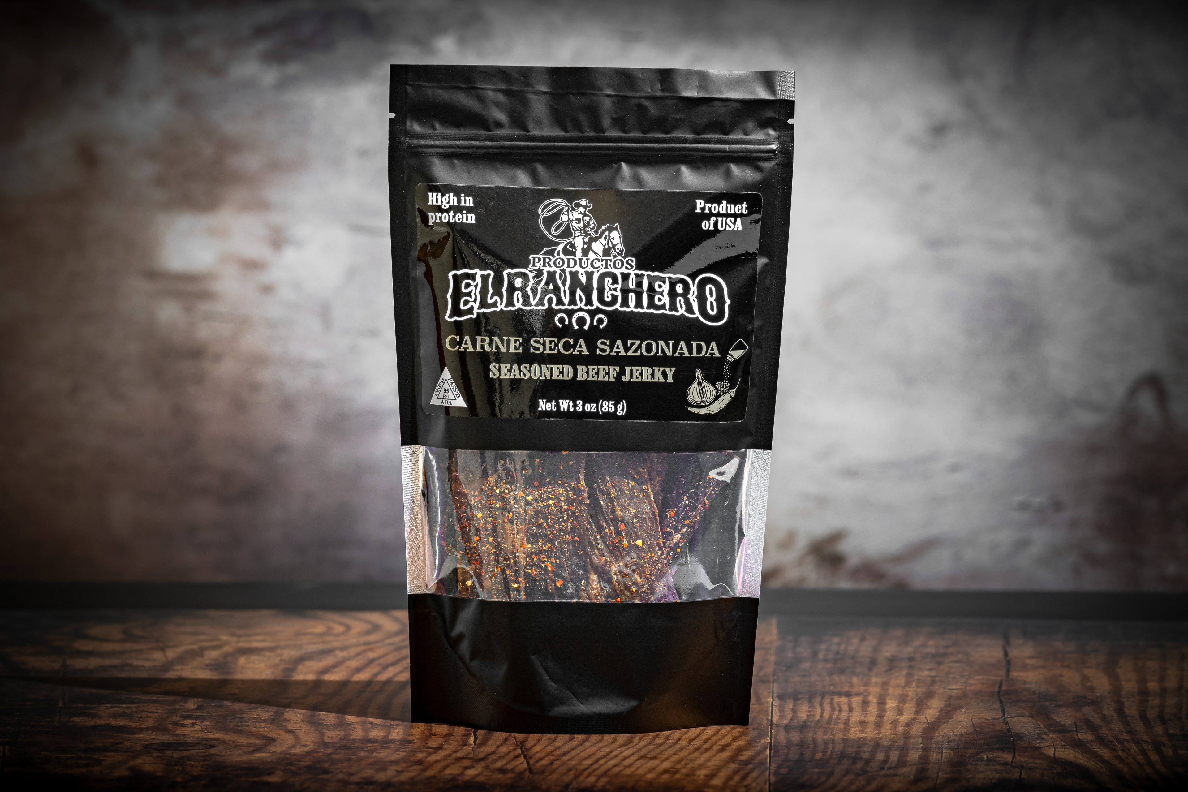 El Ranchero Carne Seca Sazonada beef jerky package on a wooden surface.